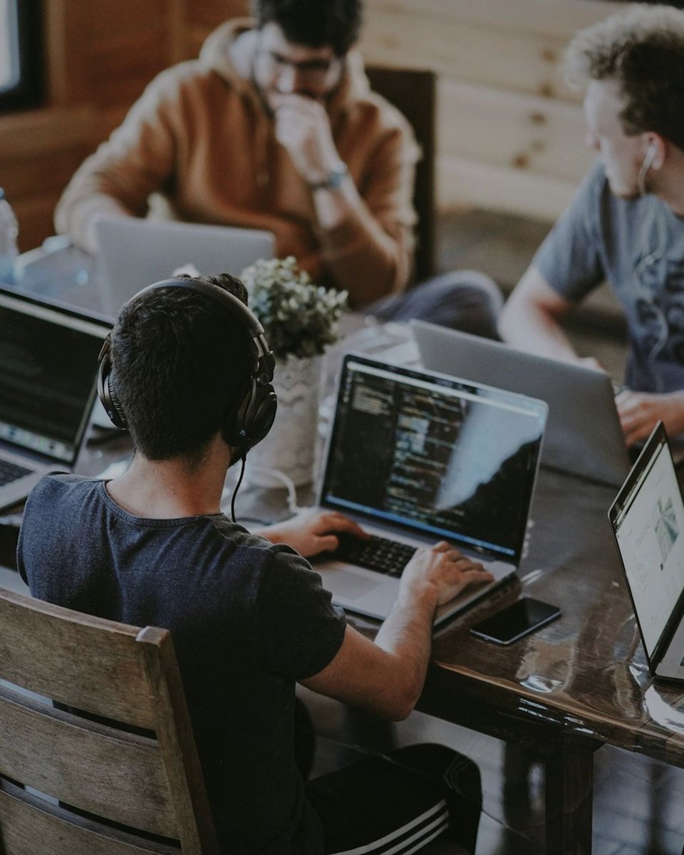 Founders collaborating at laptops in a Koramangala co-working space